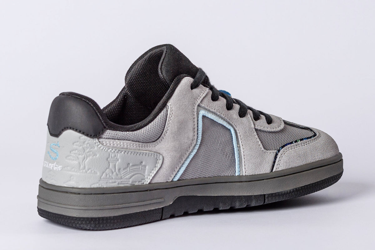 SOLEFIRE Japan Series Tokyo Nights low-top sneaker in grey suede and mesh with embossed heel and blue accent details