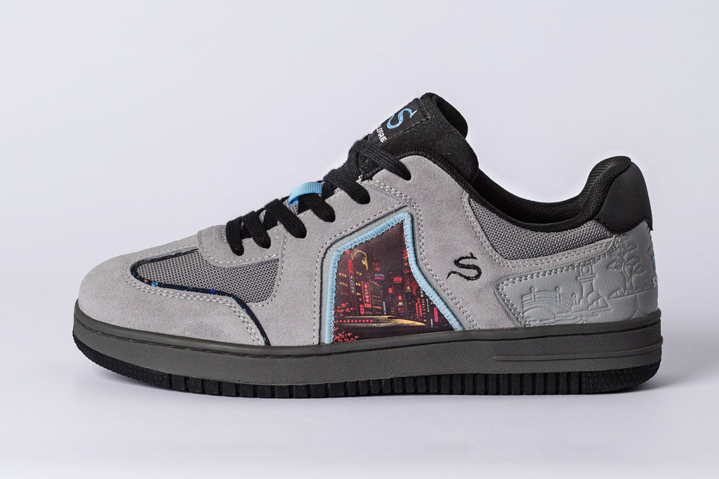 SOLEFIRE Tokyo Nights low-top sneaker in grey suede and mesh with a vibrant Tokyo cityscape graphic side panel.